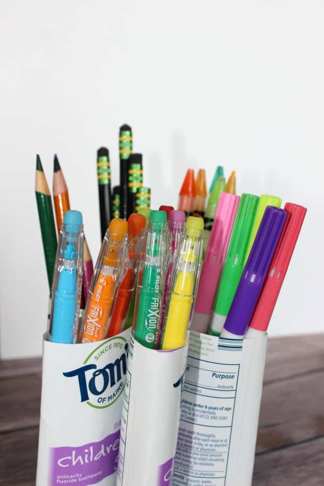 DIY Pen Organizer Toothbrush Hack. Upcycle your toothbrush containers and make your own pen, pencil, and art supply organizer with the toothpaste containers instead of throwing them away!