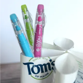 DIY Pen Organizer Toothbrush Hack. Upcycle your toothbrush containers and make your own pen, pencil, and art supply organizer with the toothpaste containers instead of throwing them away!