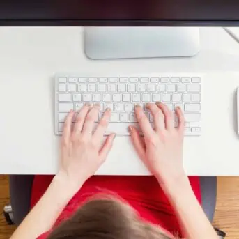Woman working in her home office from above