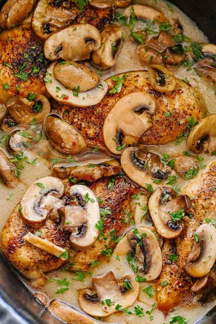 Slow Cooker Chicken Marsala close up chicken with mushrooms and parsley on top