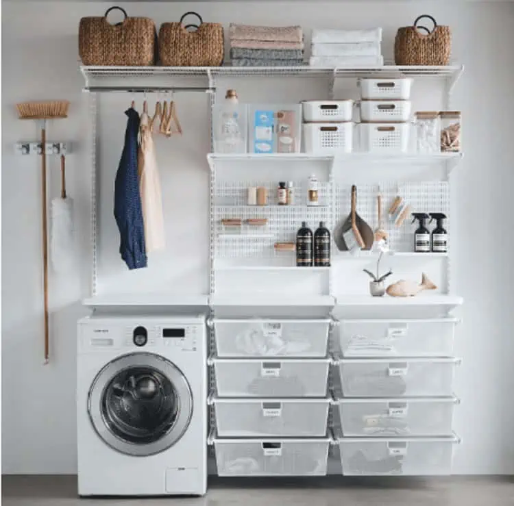 small laundry room organization with shelves, peg board, hangers and stackable containers