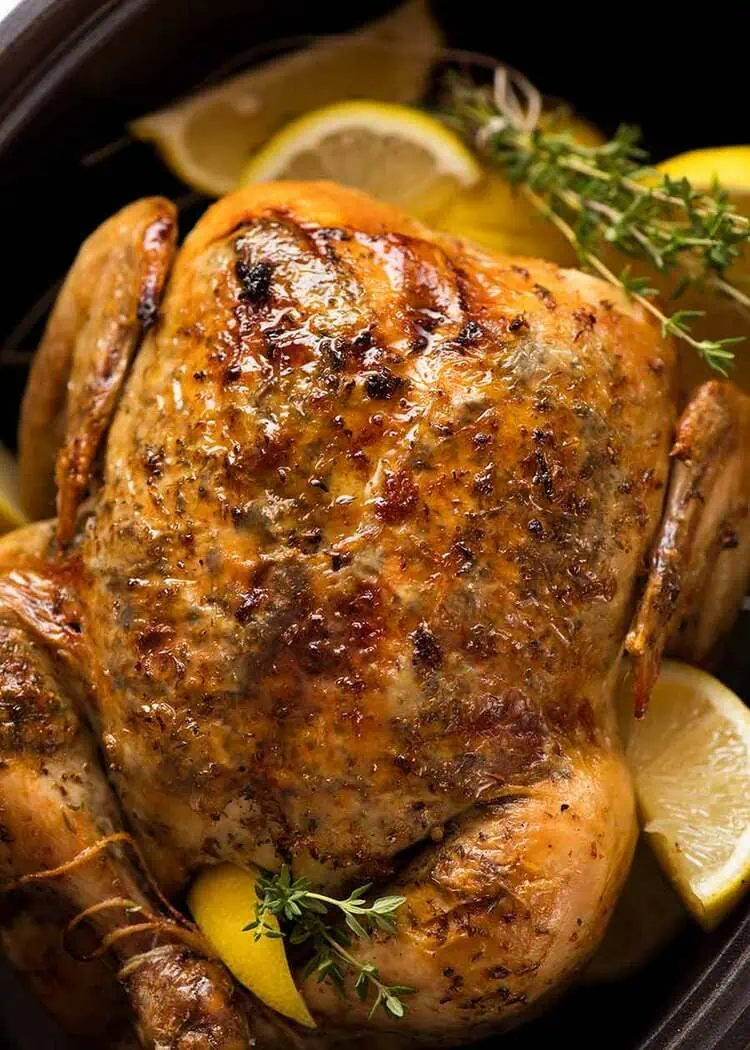 Lemon Garlic Slow Cooker Whole Chicken close up with lemon and thyme