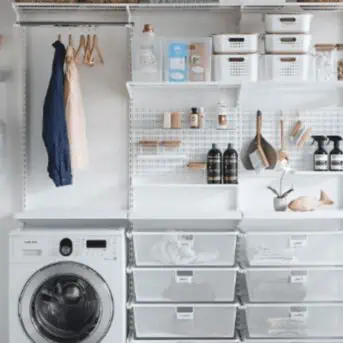 small laundry room organization with shelves, peg board, hangers and stackable containers