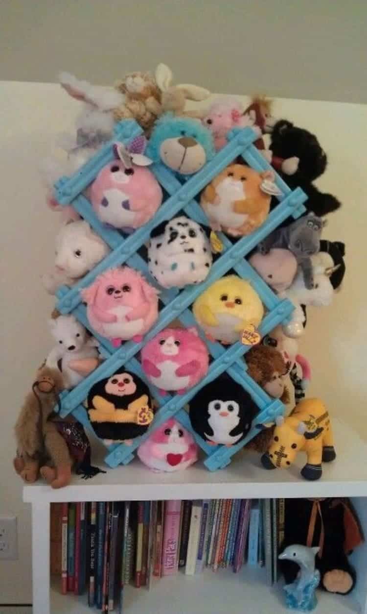 Repurposed Wine Rack Soft Toy Storage painted blue and full of stuffed toys