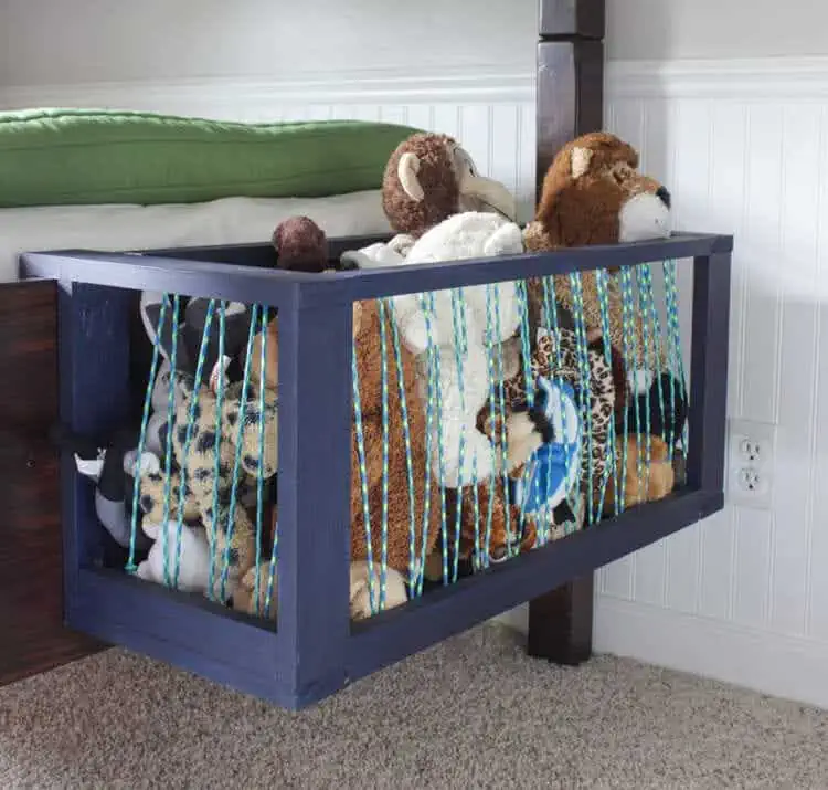 stuffed animals storage corral to store the toys hanging on the bed in your kids room