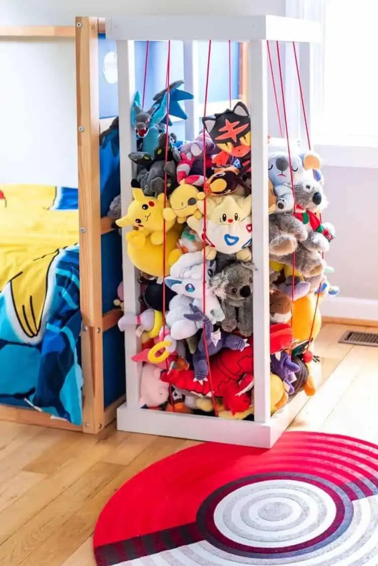 DIY Stuffed animals zo next to a bed in a boys room in pokemon theme