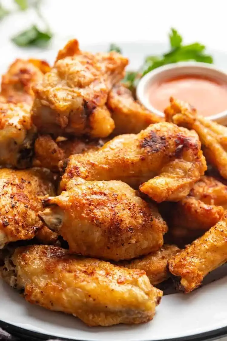 oil-free chicken wings air fryer recipe close photo with a red dip