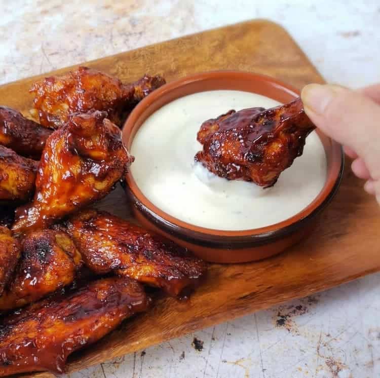 Air Fryer Honey BBQ Chicken Wings and drumsticks dipped in ranch dressing