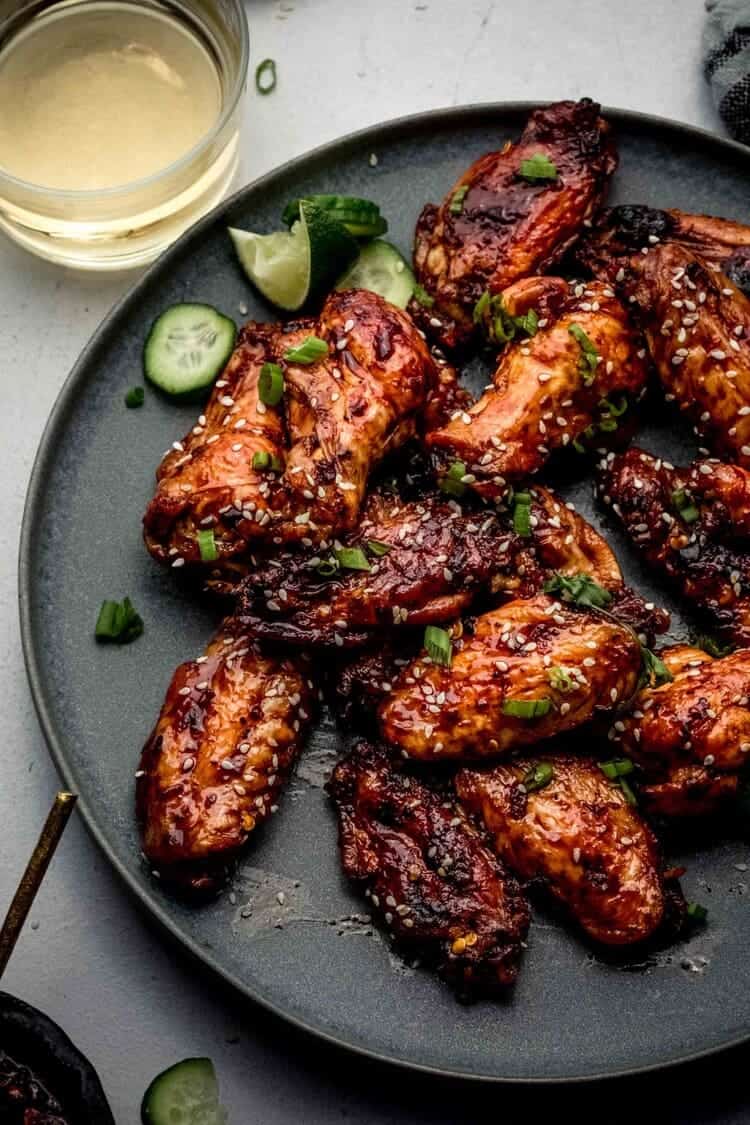 Air Fryer Chinese Chicken Wings sprinkled with sesame seed served on a plate