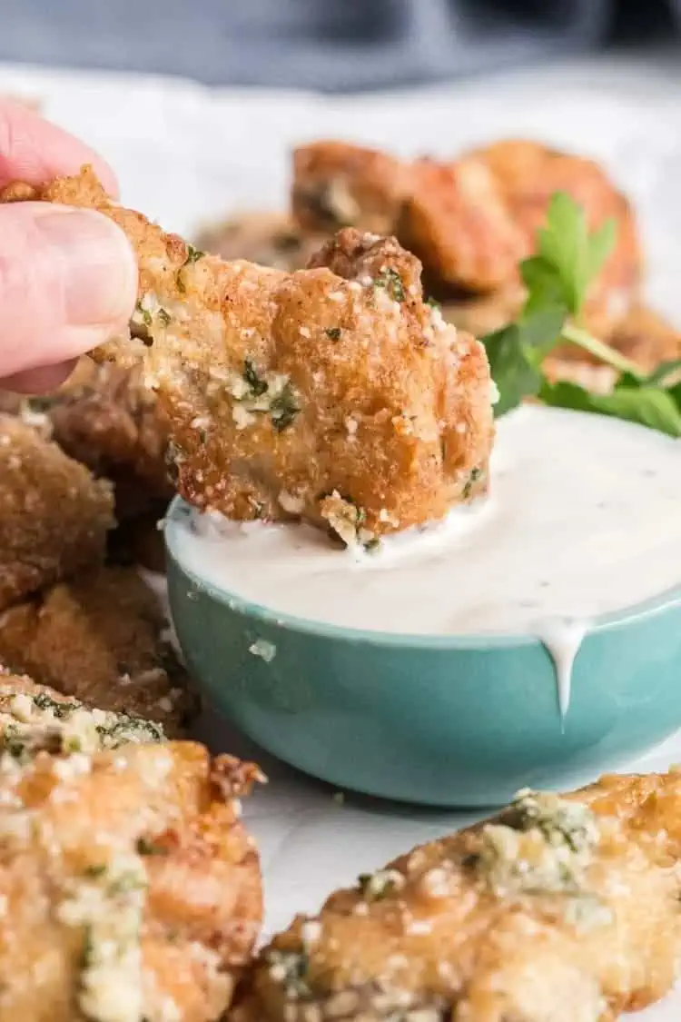 Air Fried Garlic Parmesan Wings dipped in ranch sauce