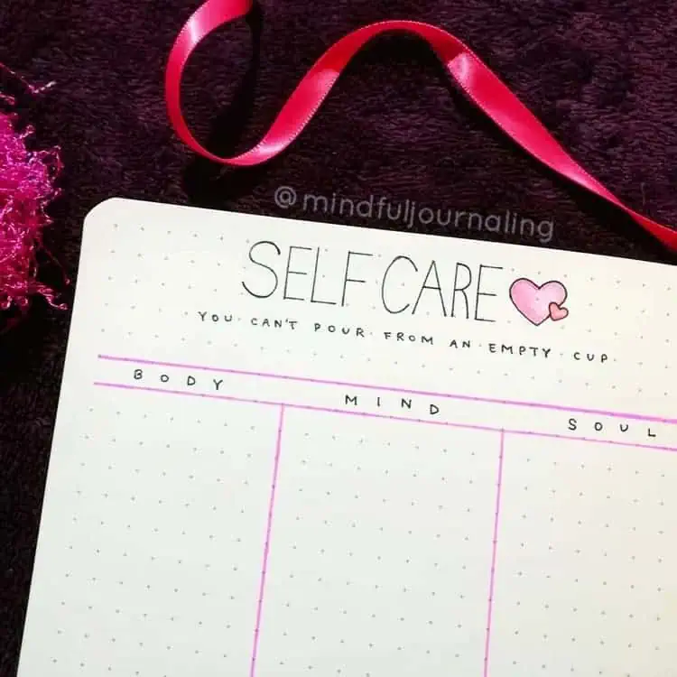 minimalist bullet journal ideas self care spread with three columns for body mind and soul