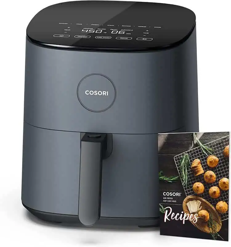 COSORI 9-in-1 Air Fryer, 5 QT black with a recipe book next to it