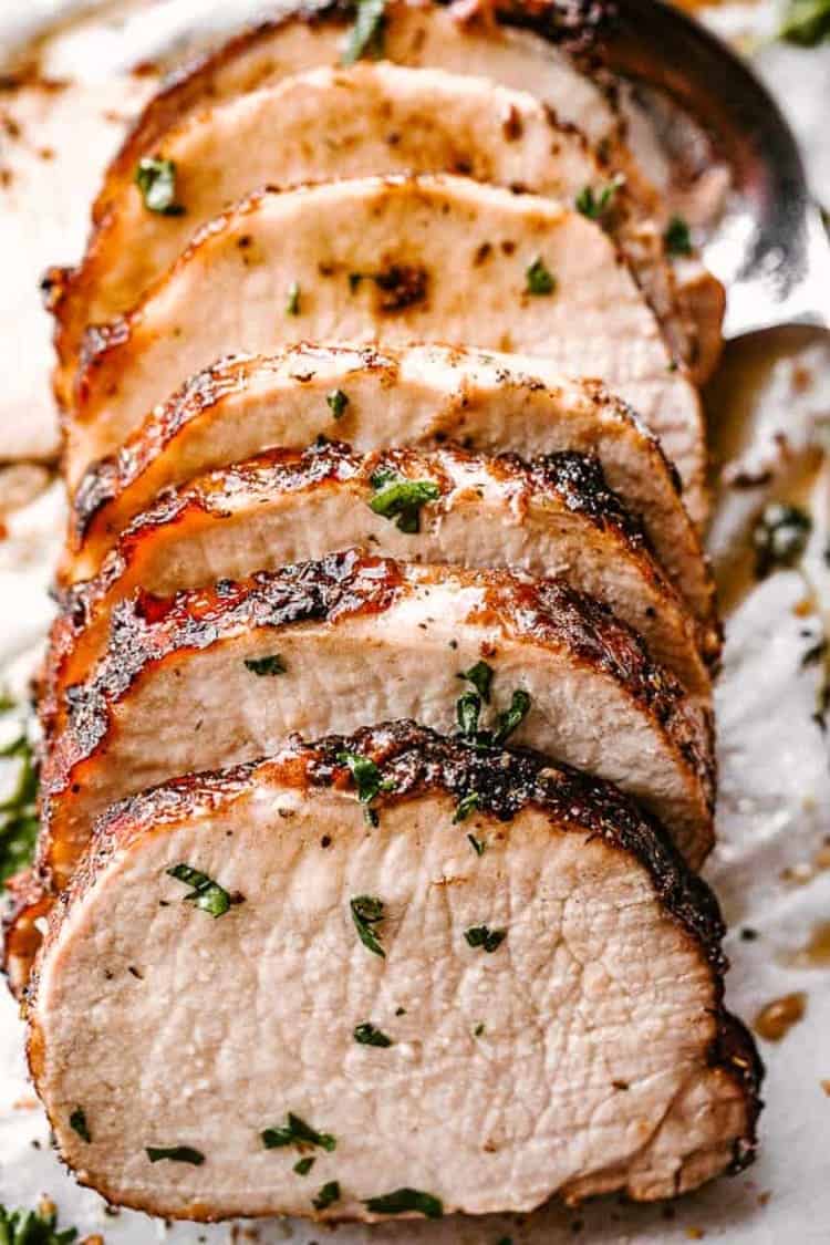 crock pot garlic balsamic pork loin recipe cooked and served sprinkled with greens