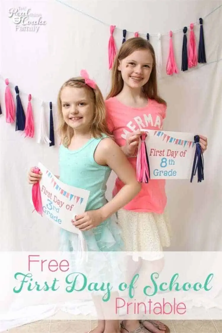 first day of school sign two girls holding signs for 3rd and 8th grade