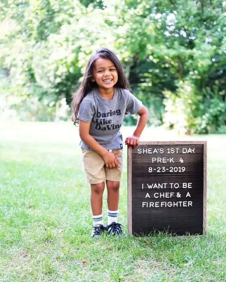 Indian boy holding a Letter Board First Day of School Sign