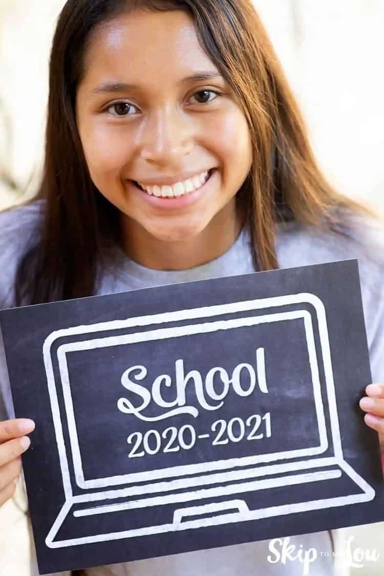 Back-to-School Photo Signs girl holding a printable sign saying school and the year