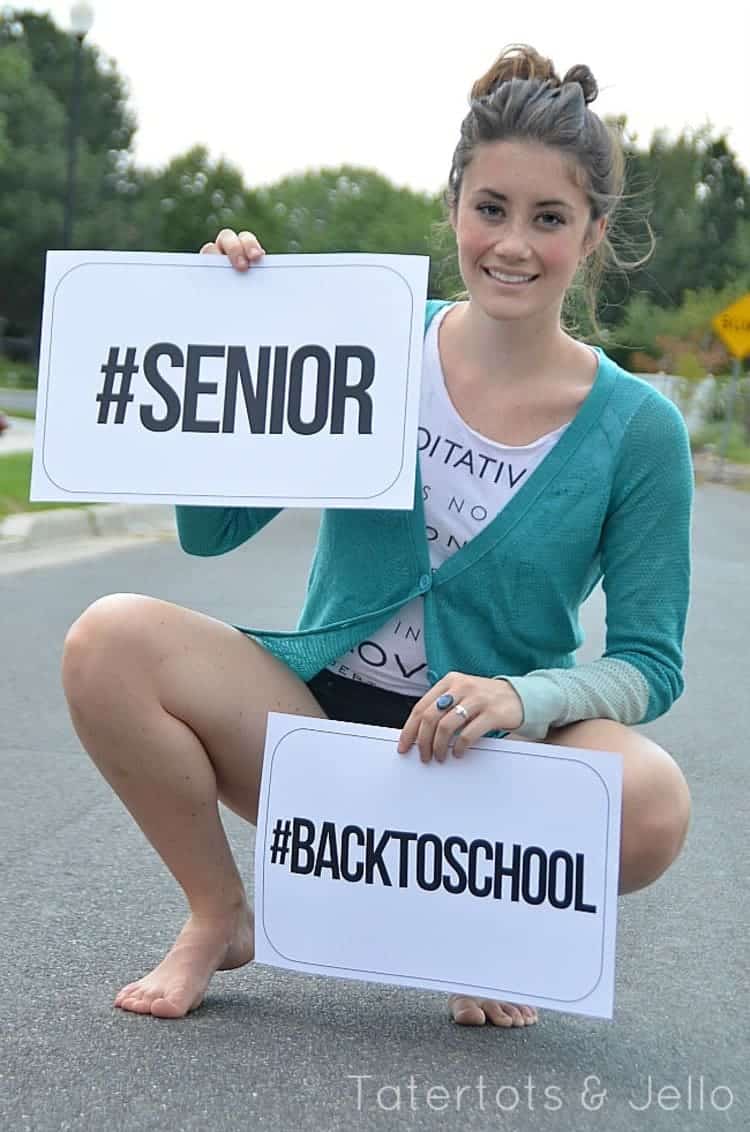 A girl holding an Instagram-Ready Hashtag Back-to-School Photo Prop Printable