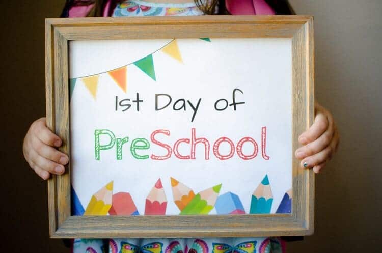 First Day of School Signs a girl holding a preschool sign