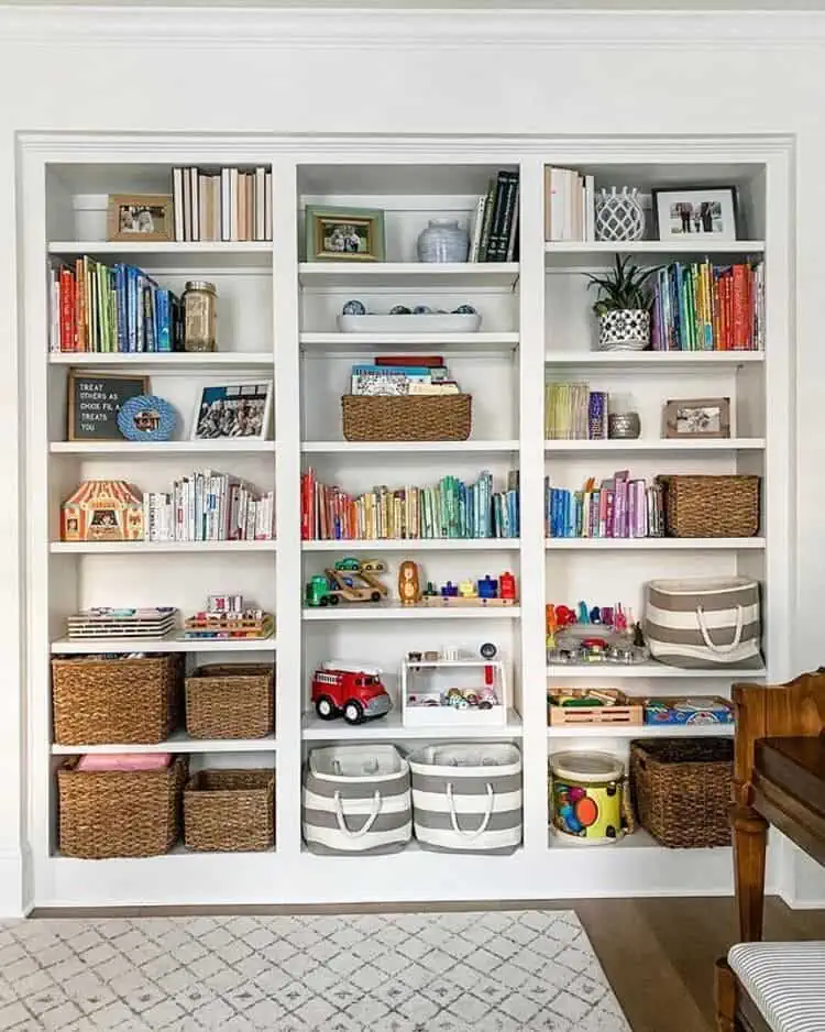Built-in Bookshelves for Toy Storage in the Living Room with bins baskets and books