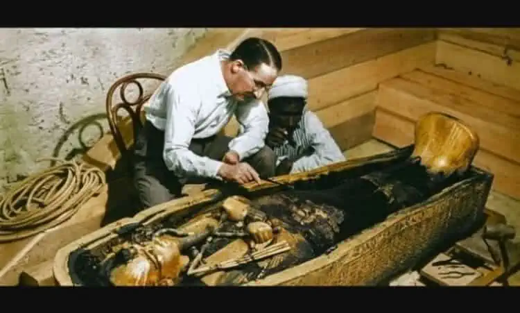 Howard Carter inspects the sarcophagus of Tutankhamun colored photo january calendar historical event