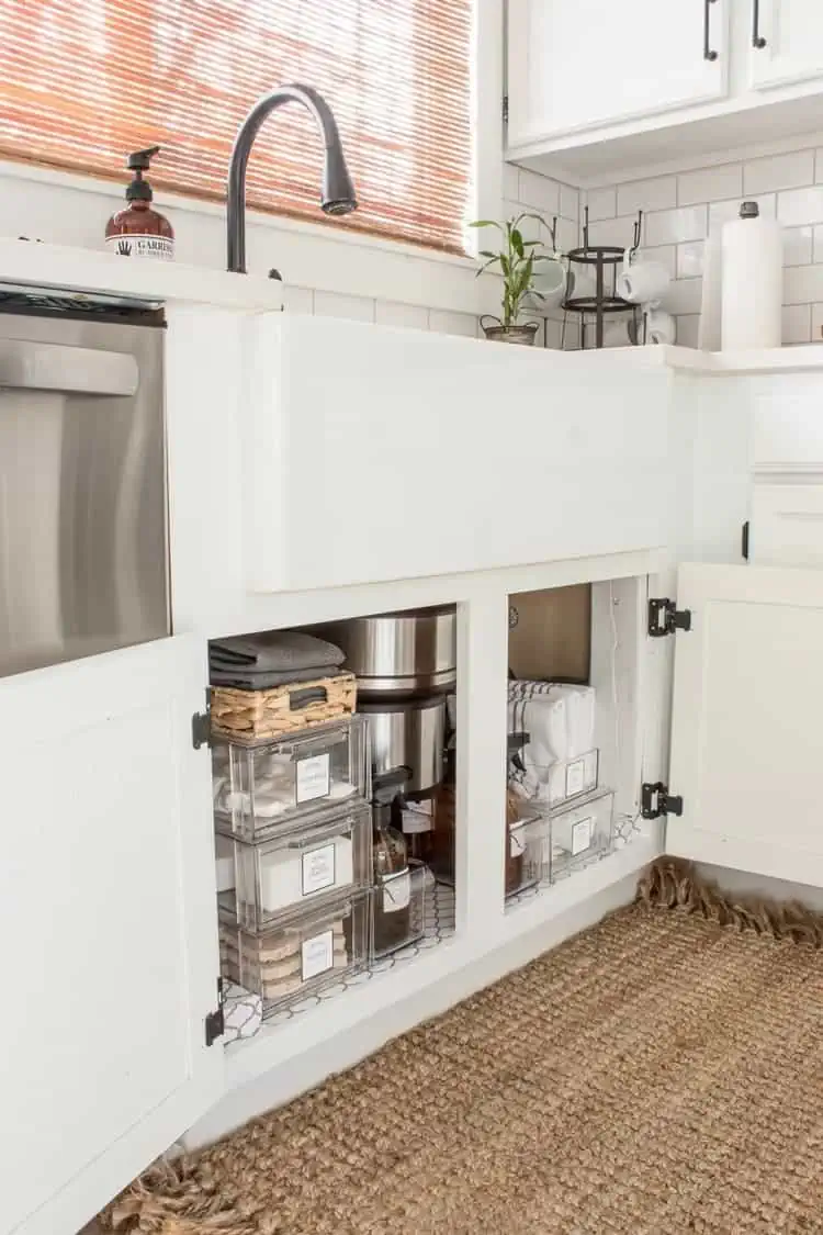 organizing under the kitchen sink with plastic containers organizational system