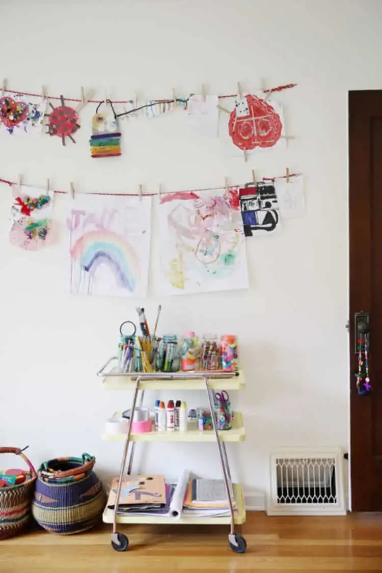 Art Supplies Crate next to a wall with kids art