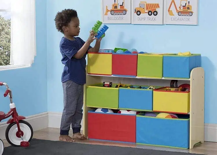 9-Bin Toy Storage Organizer and a child next to it organizing toys