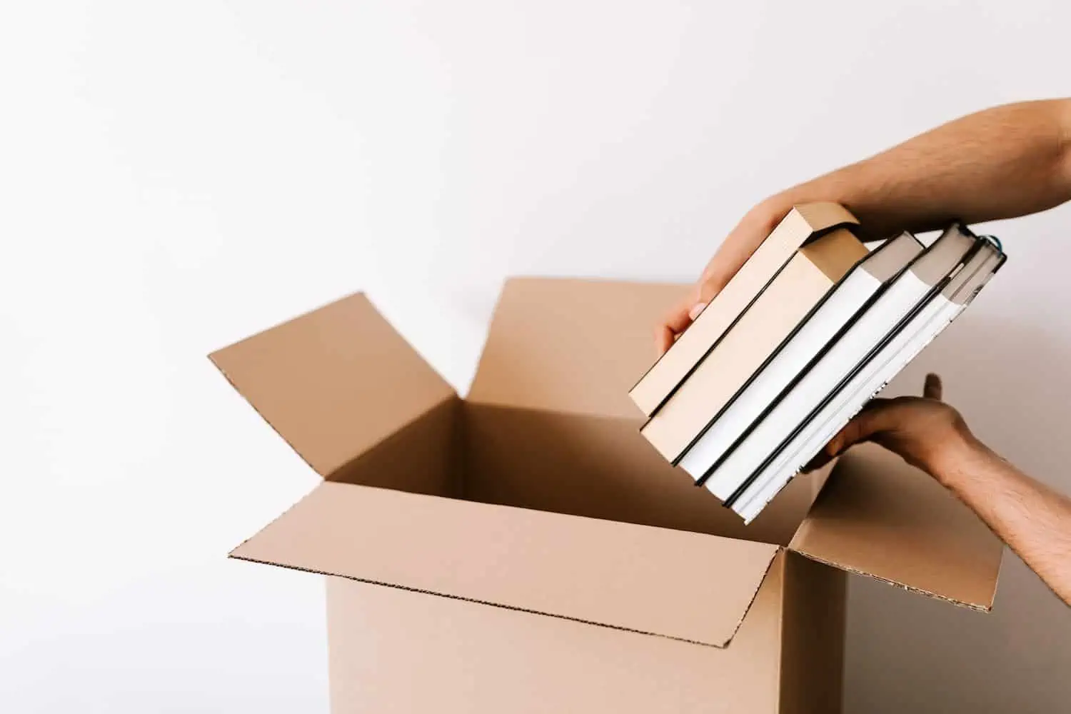 Books being put into a box.