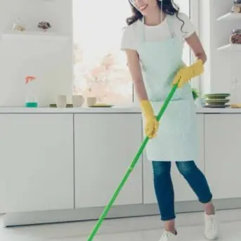 woman cleaning listening to music