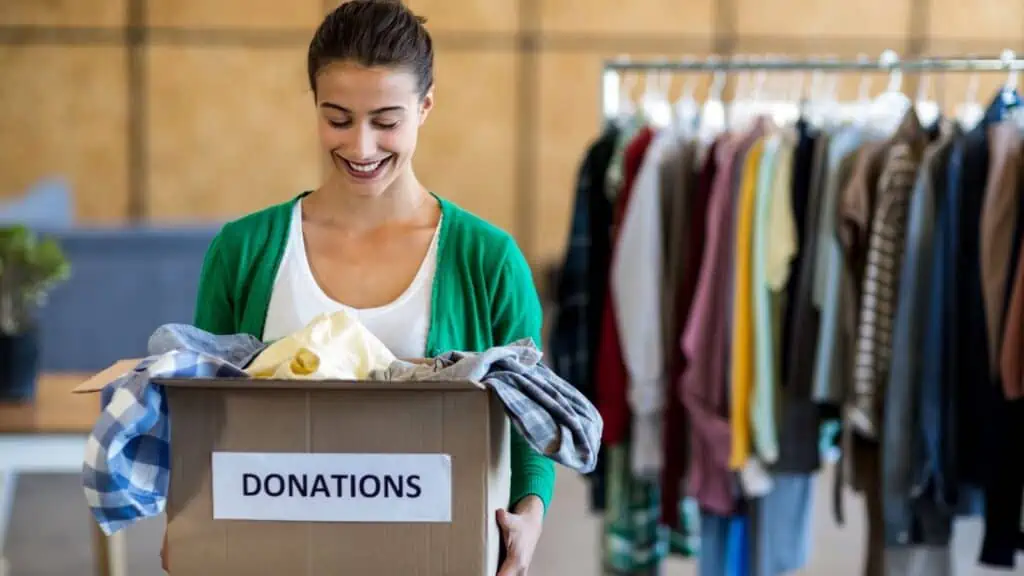 woman holding box of donations