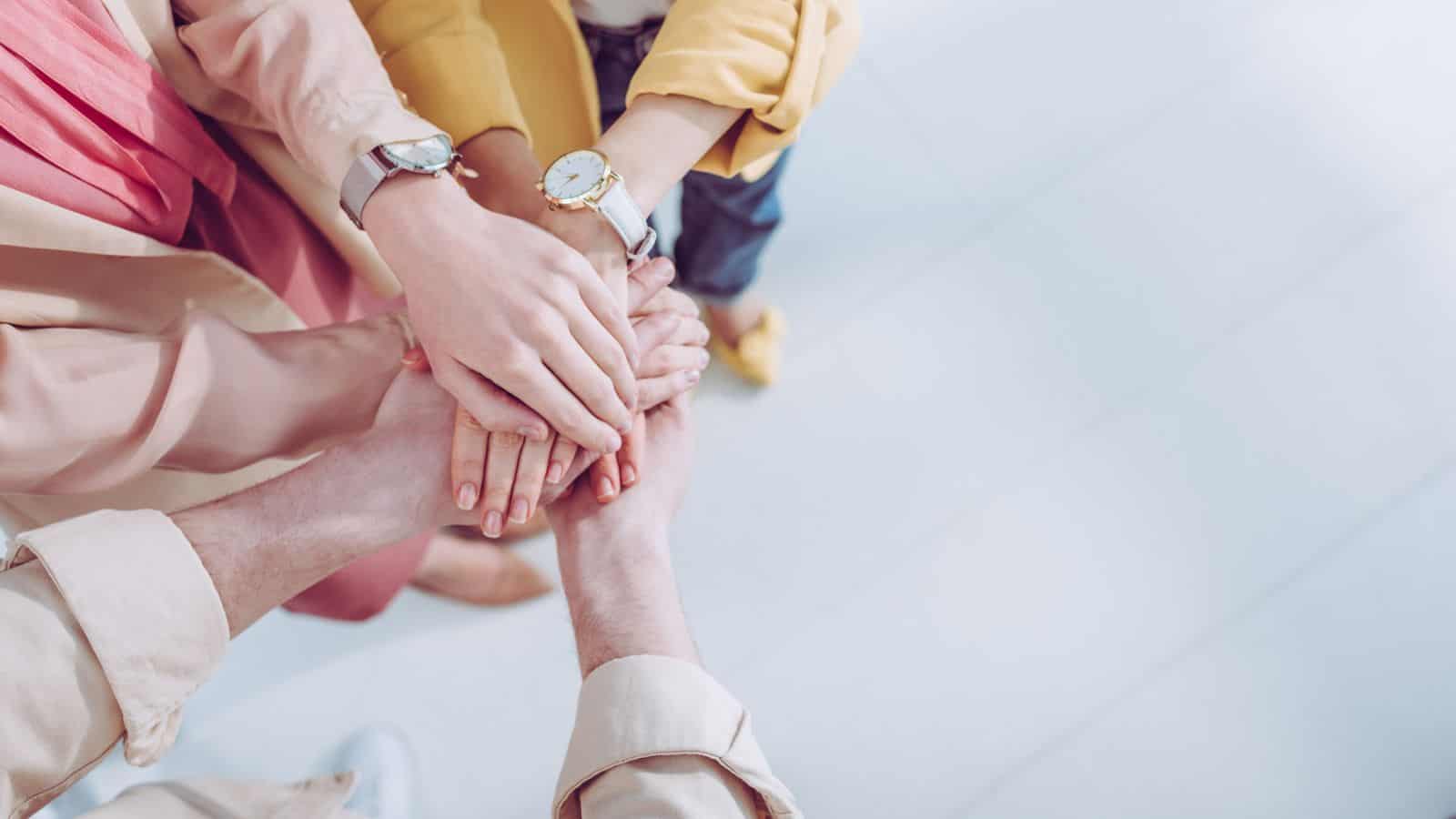 women's hands on top of one another