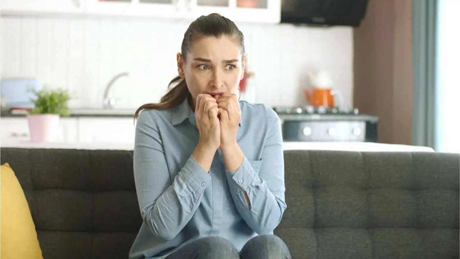 Woman biting nails