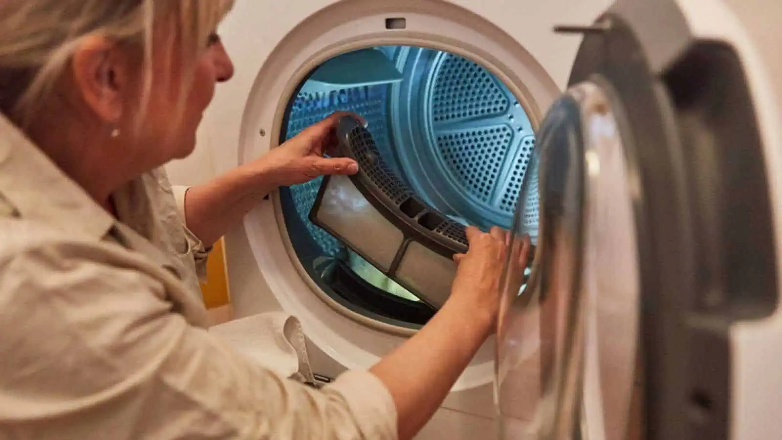 Woman cleaning Lint Filter