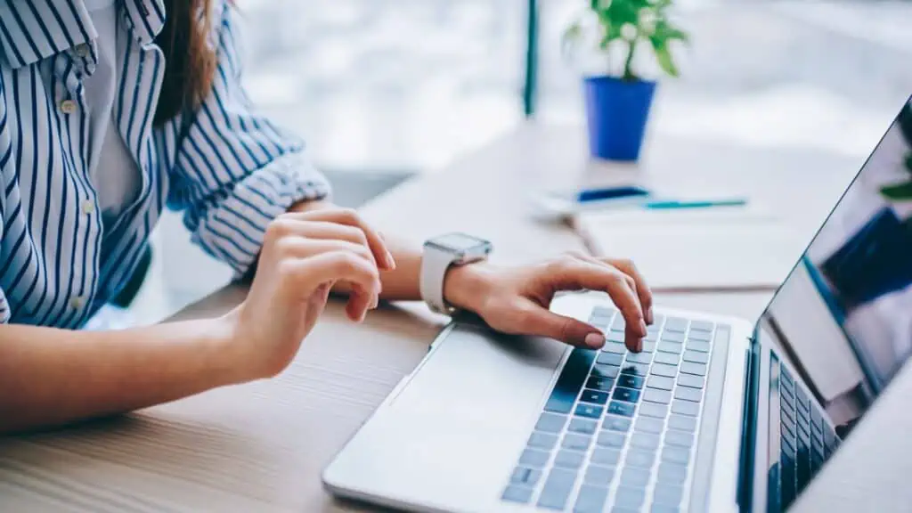 female hands working on a laptop