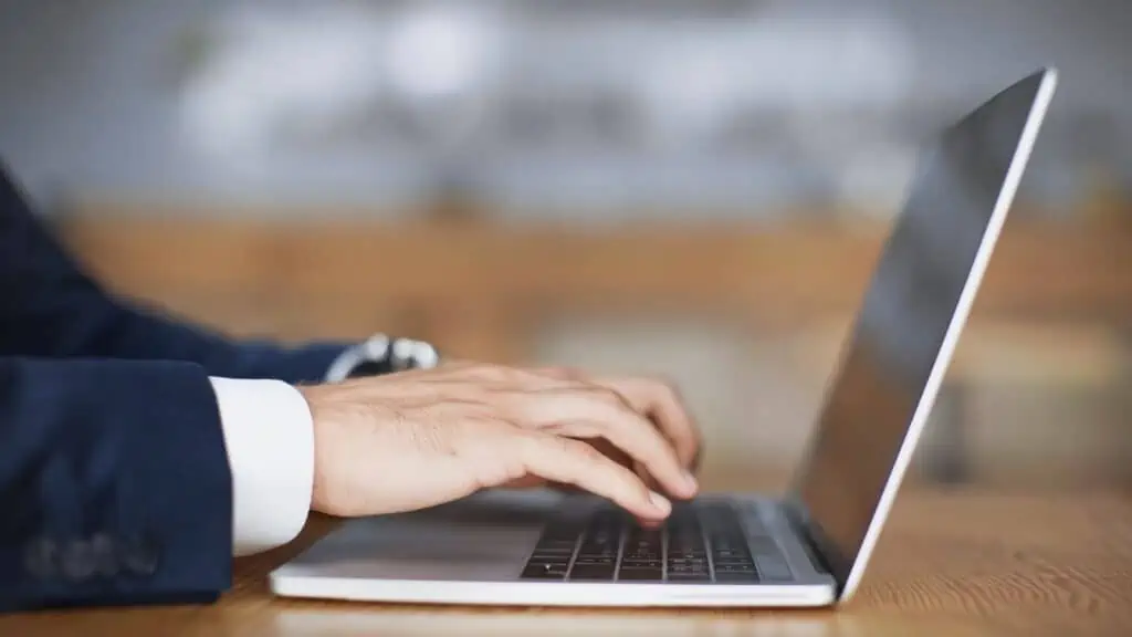 male hands working on a laptop