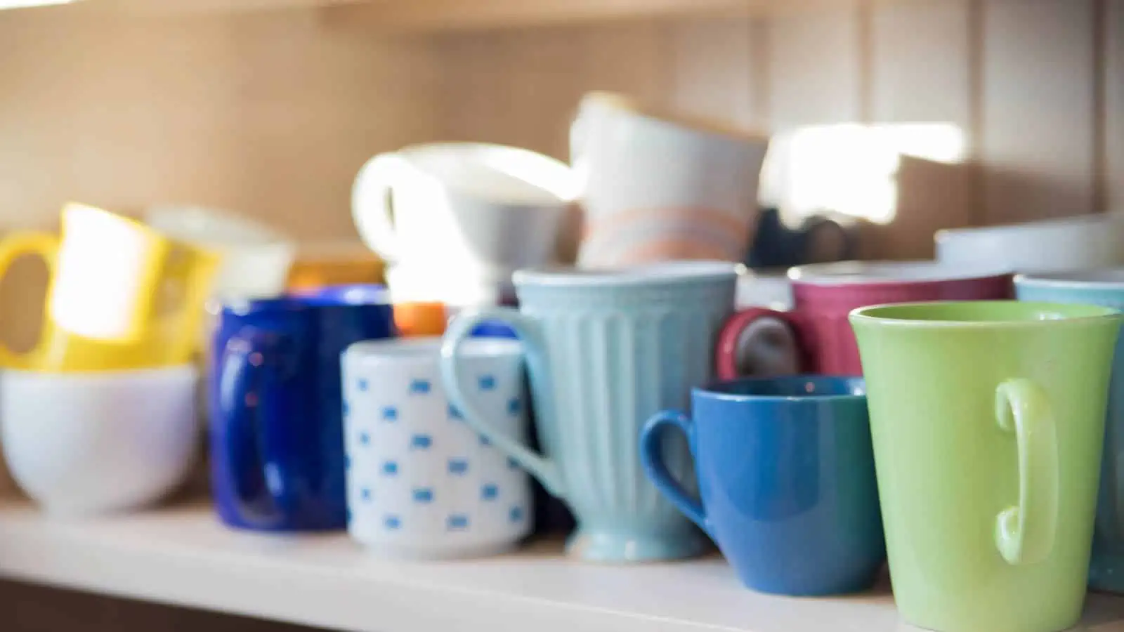 mugs on a kitchen shelf