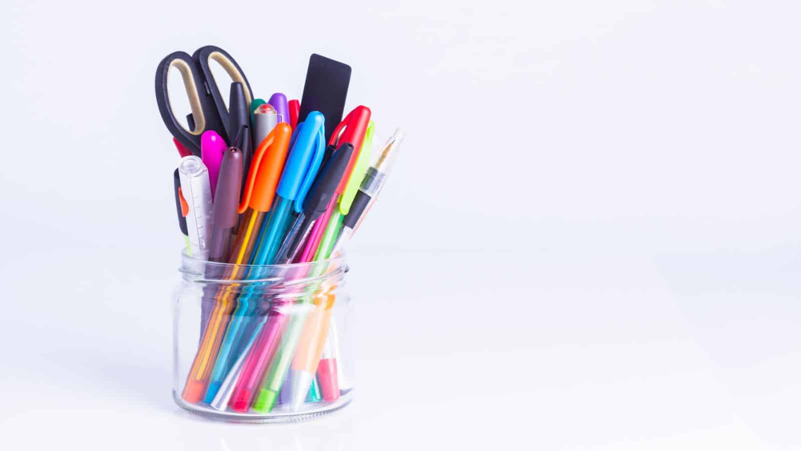pens and markers in a glass jar