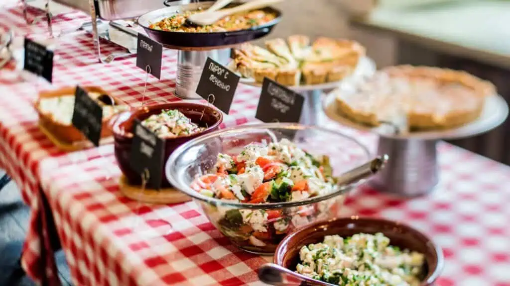 food dishes out for buffet potluck