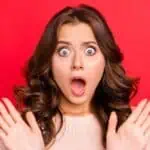 shocked woman red background