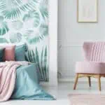 teal and pink room with pink rug