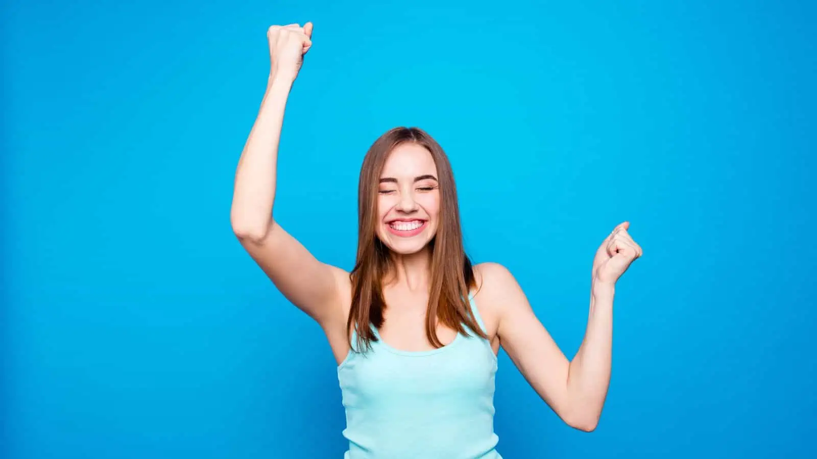 happy woman with arms in the air