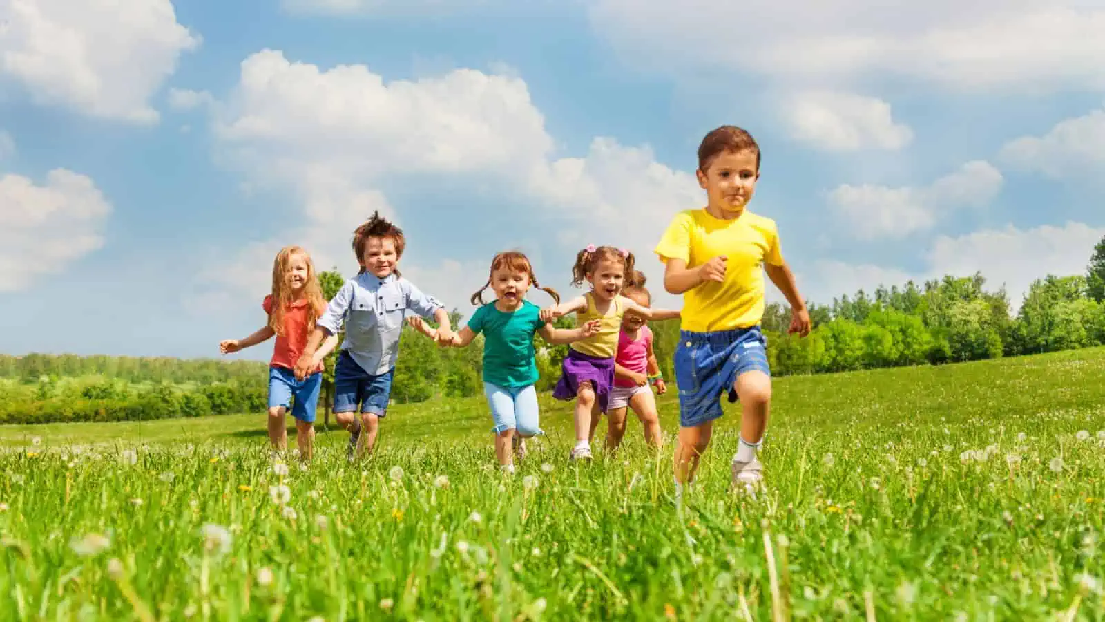 kids running through a field