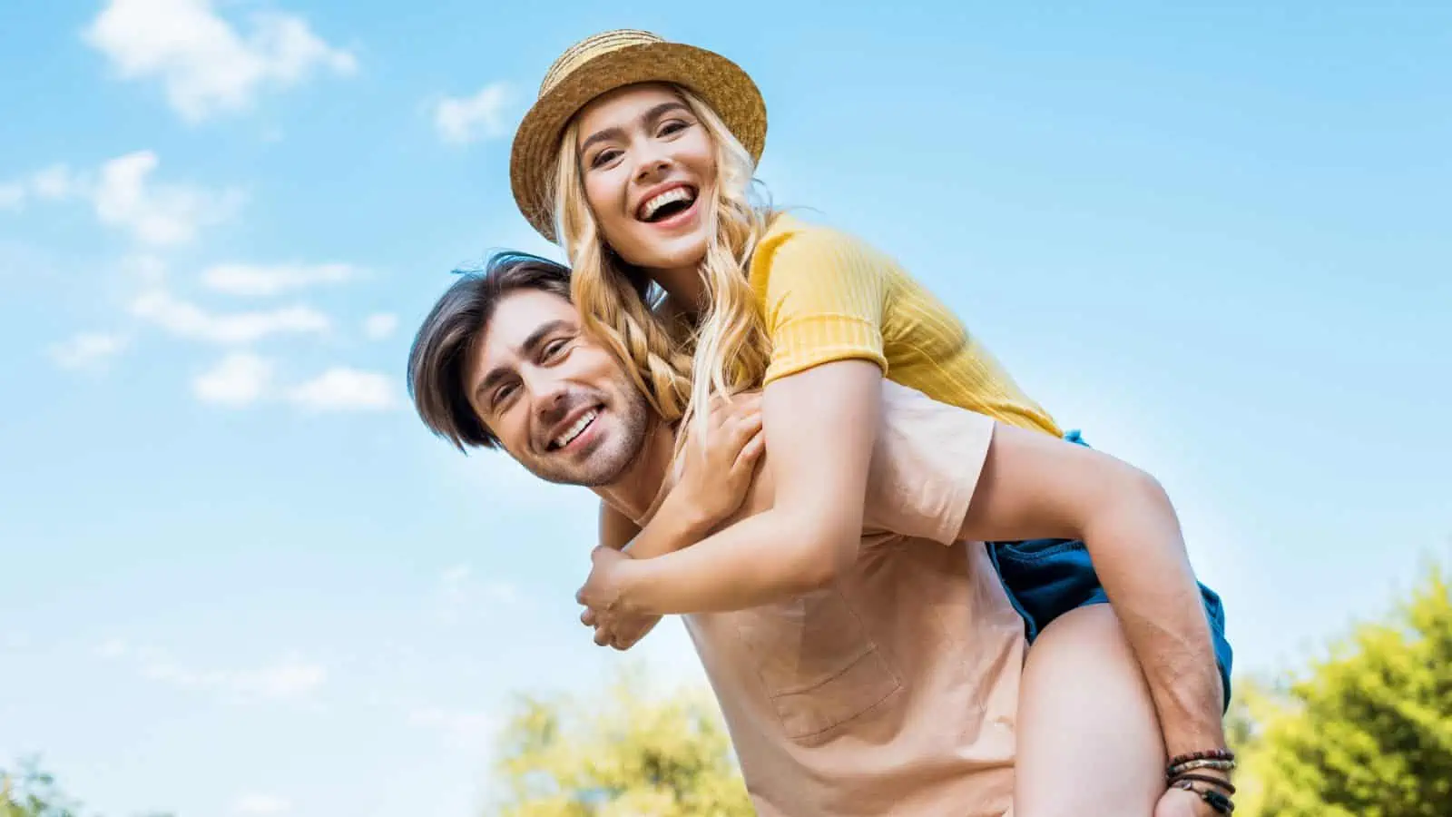 man giving woman piggyback ride