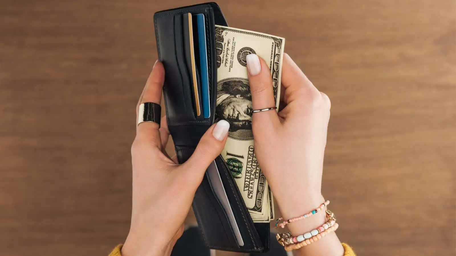 woman getting money out of wallet