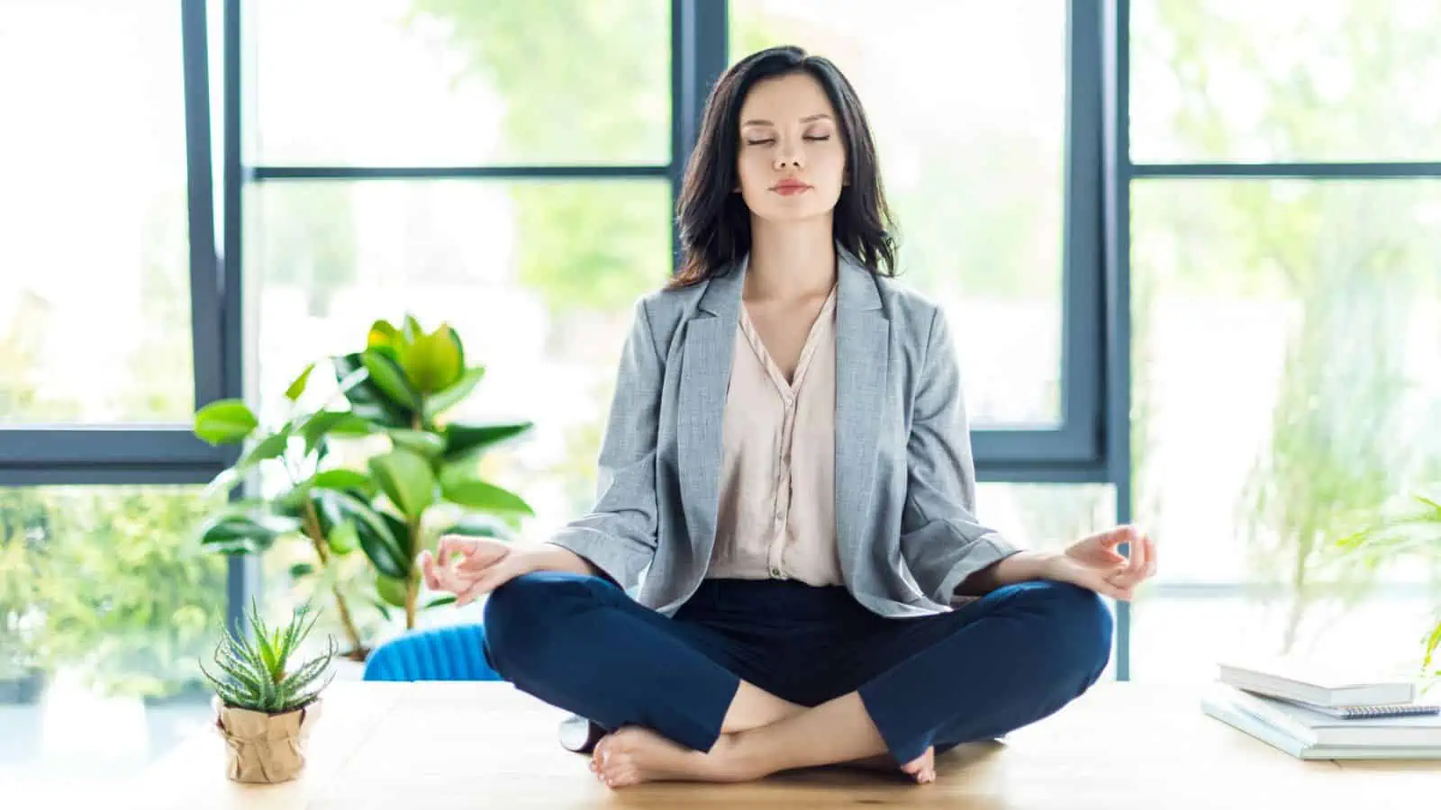 woman meditating on a table