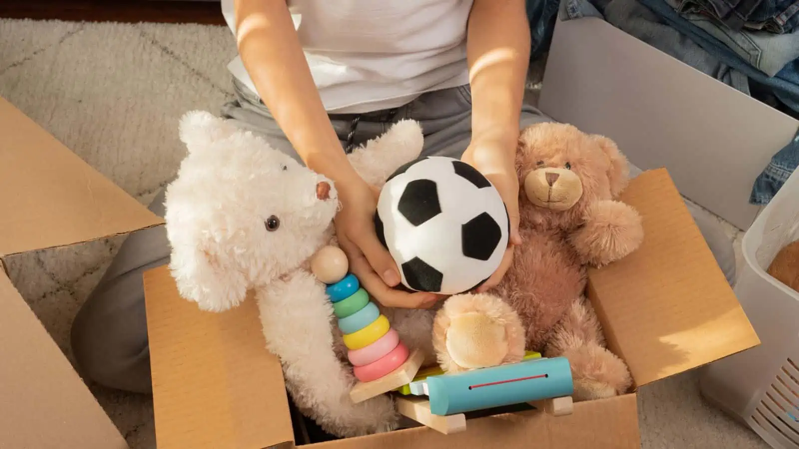 woman packing toys in box