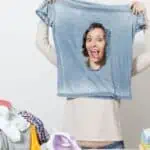 woman peeking through ripped tshirt