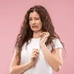 disgusted woman pink background