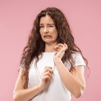 disgusted woman pink background