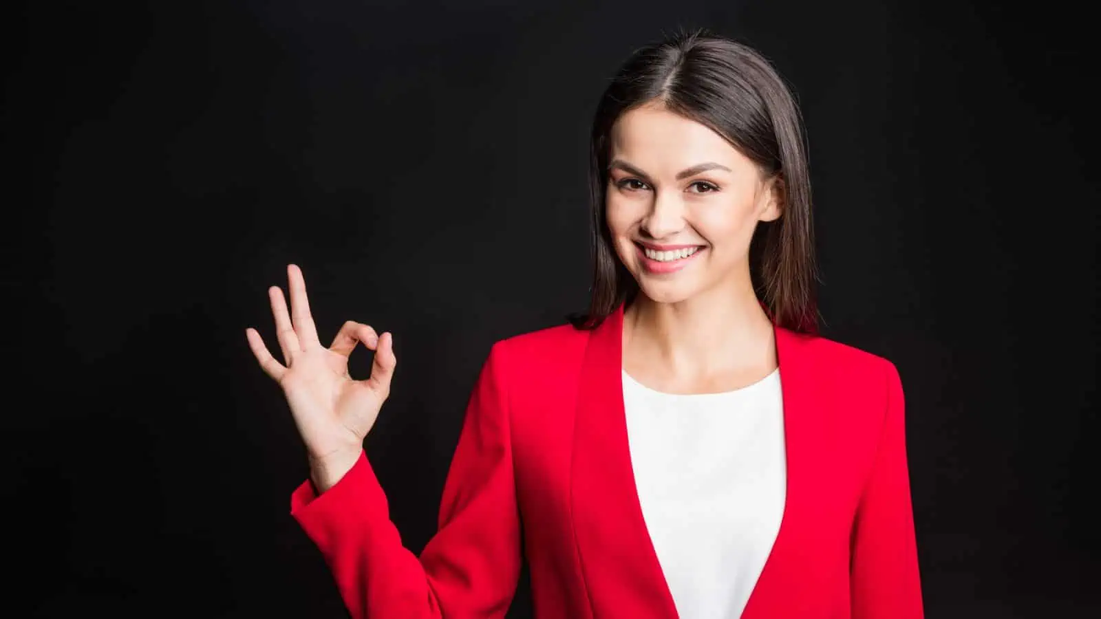 professional woman making okay sign